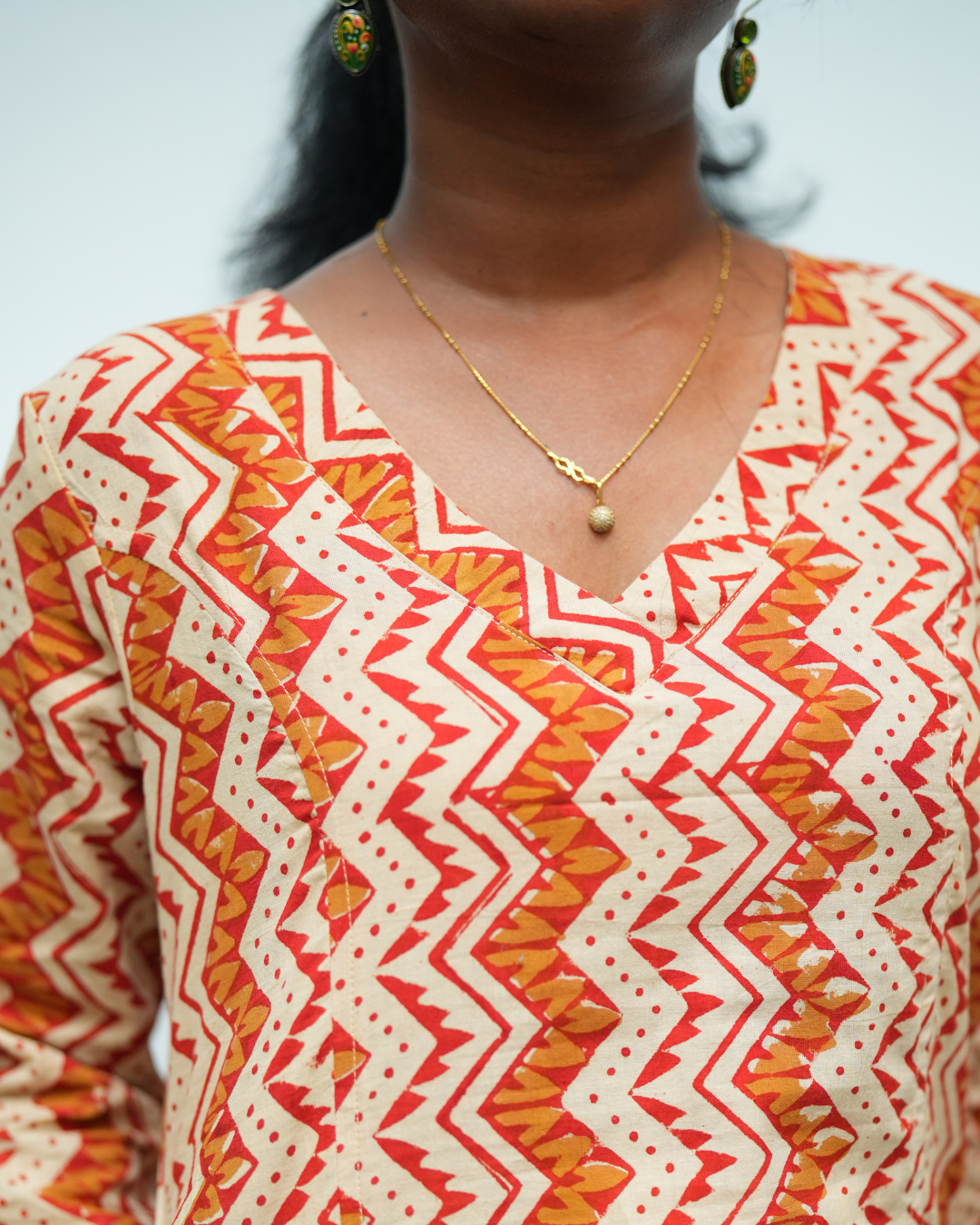 Brick red and beige hand block Printed Prinsess cut Cross V Neck Kurti