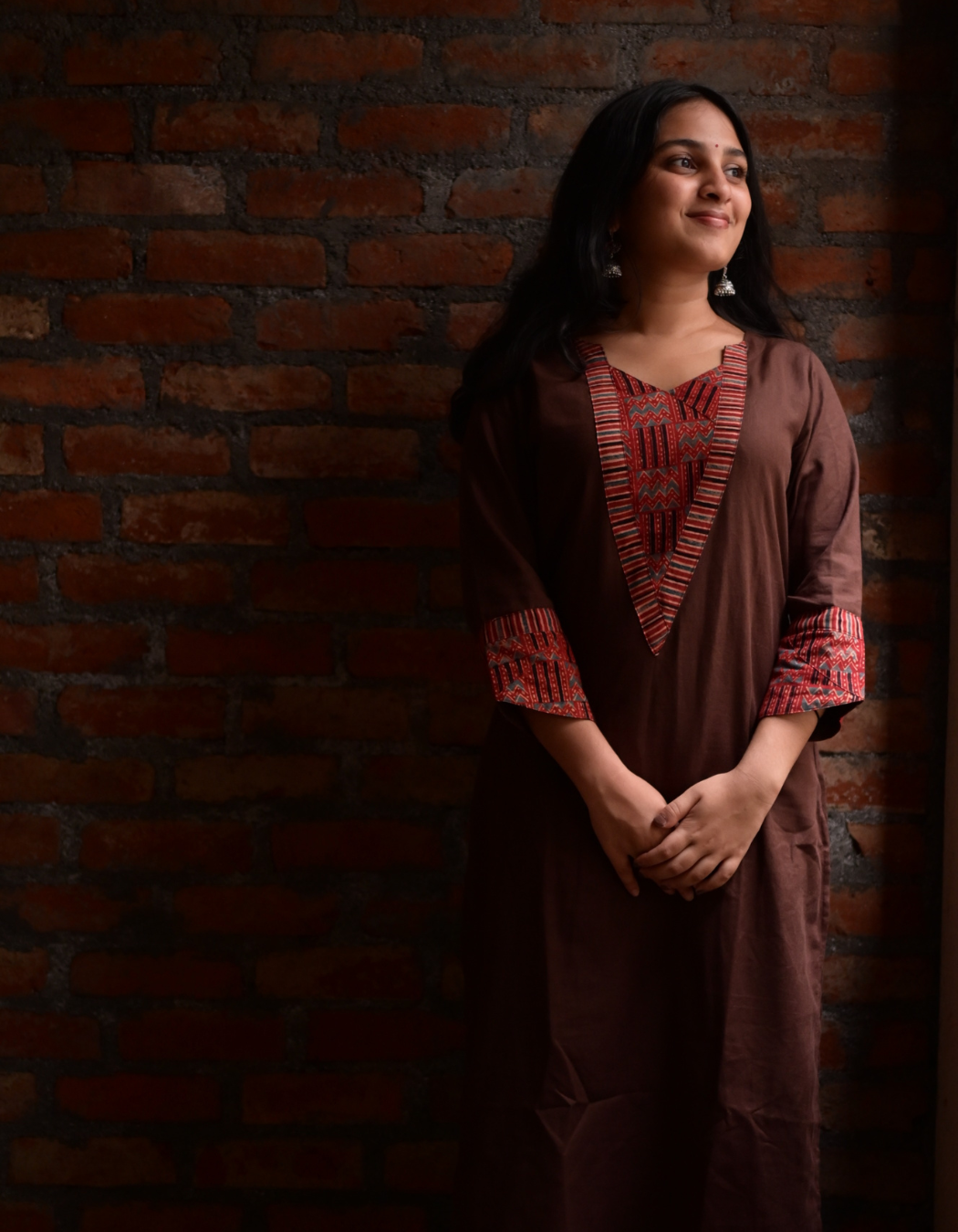 "TARA"BROWN BASE AND PINK AJRAKH PRINTED PATCH KURTI