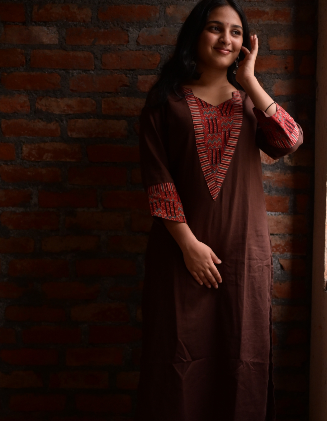 "TARA"BROWN BASE AND PINK AJRAKH PRINTED PATCH KURTI
